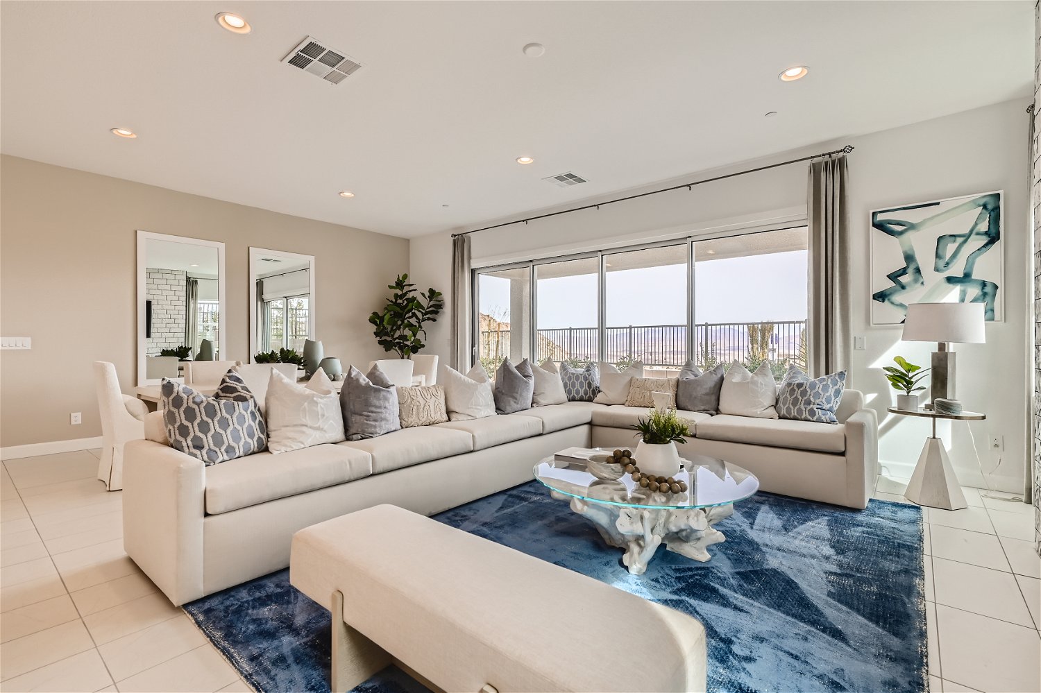 A large living room with a large window.