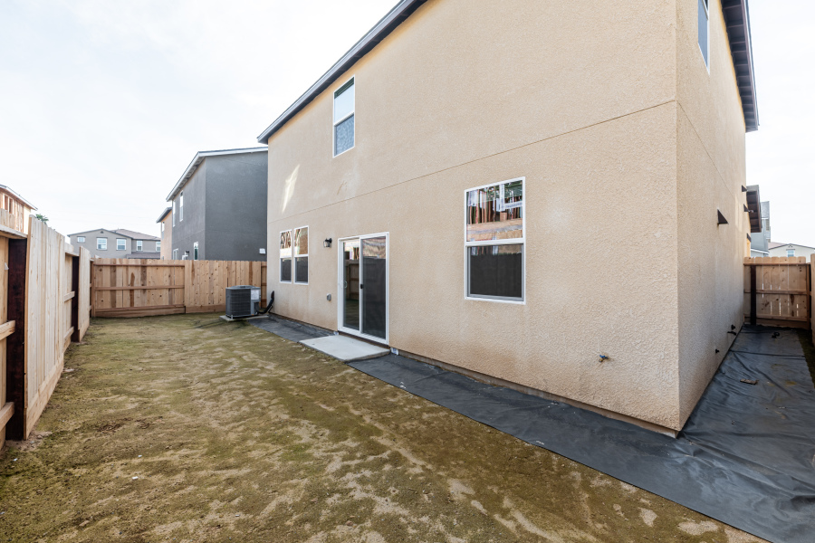 A building with a pool in the front.