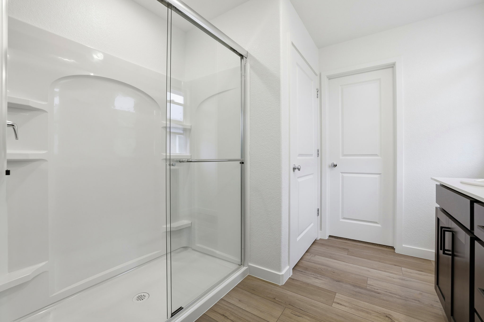 A bathroom with a glass shower.