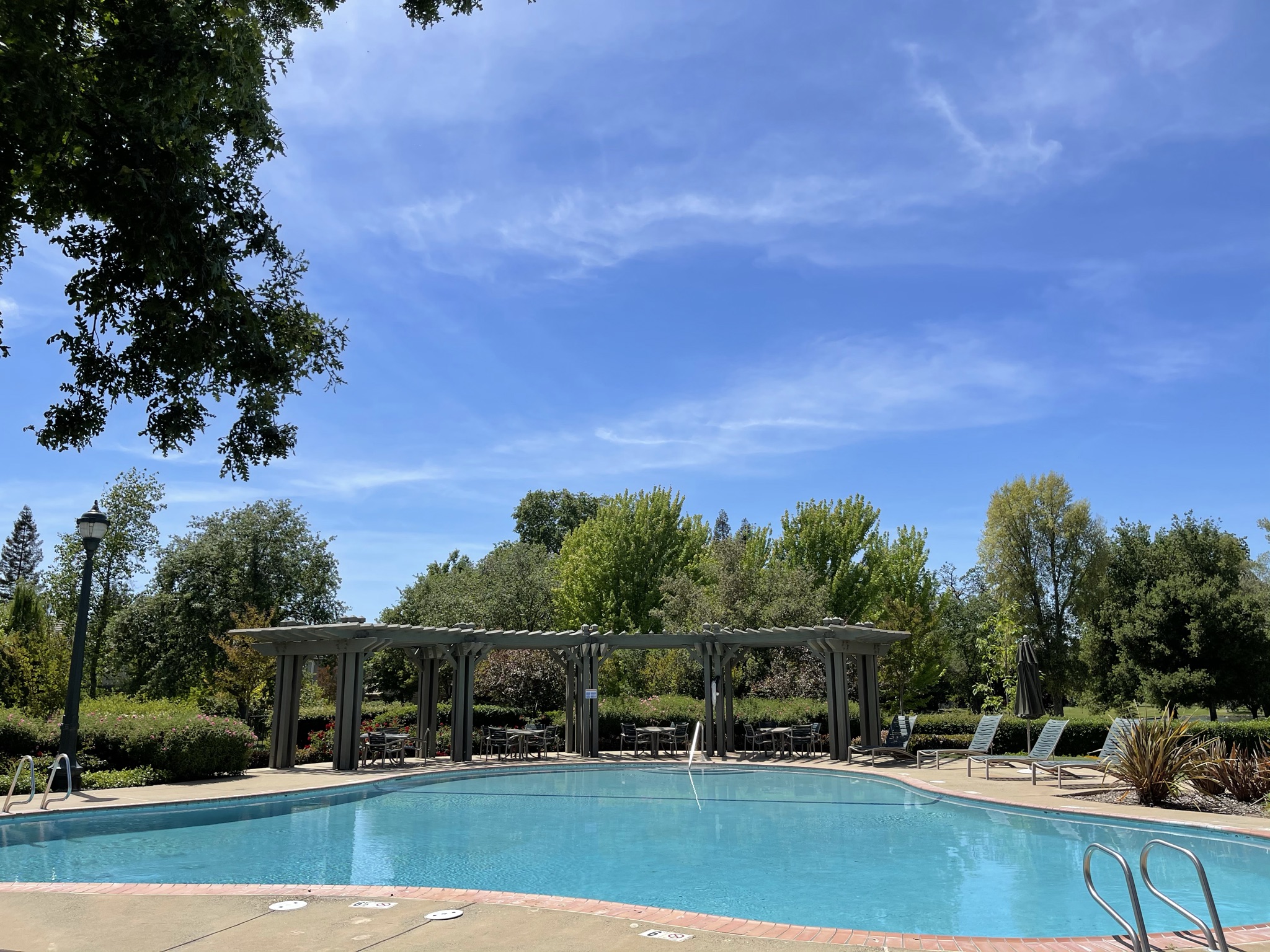 A swimming pool with a covered area.