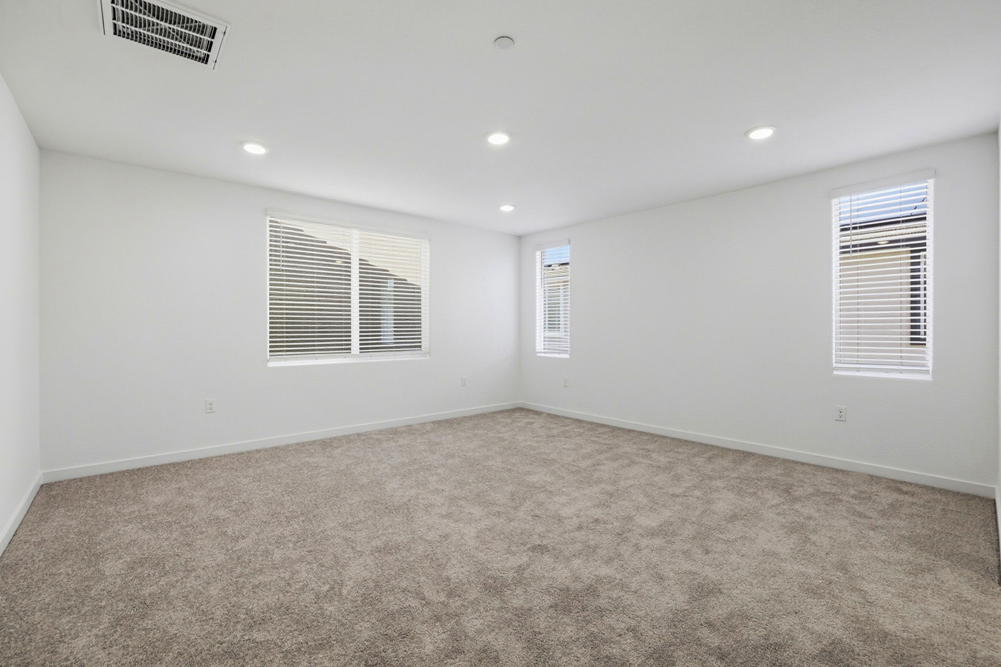 A room with a carpet and a carpet.