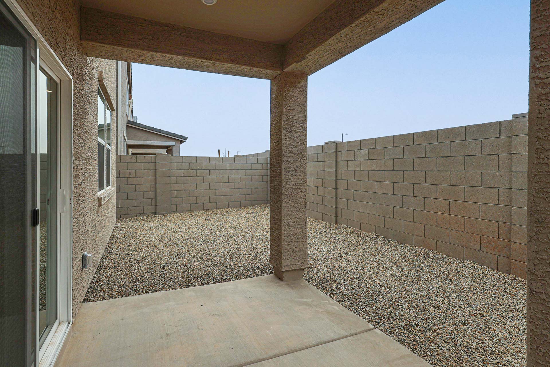 A stone wall with a stone walkway.
