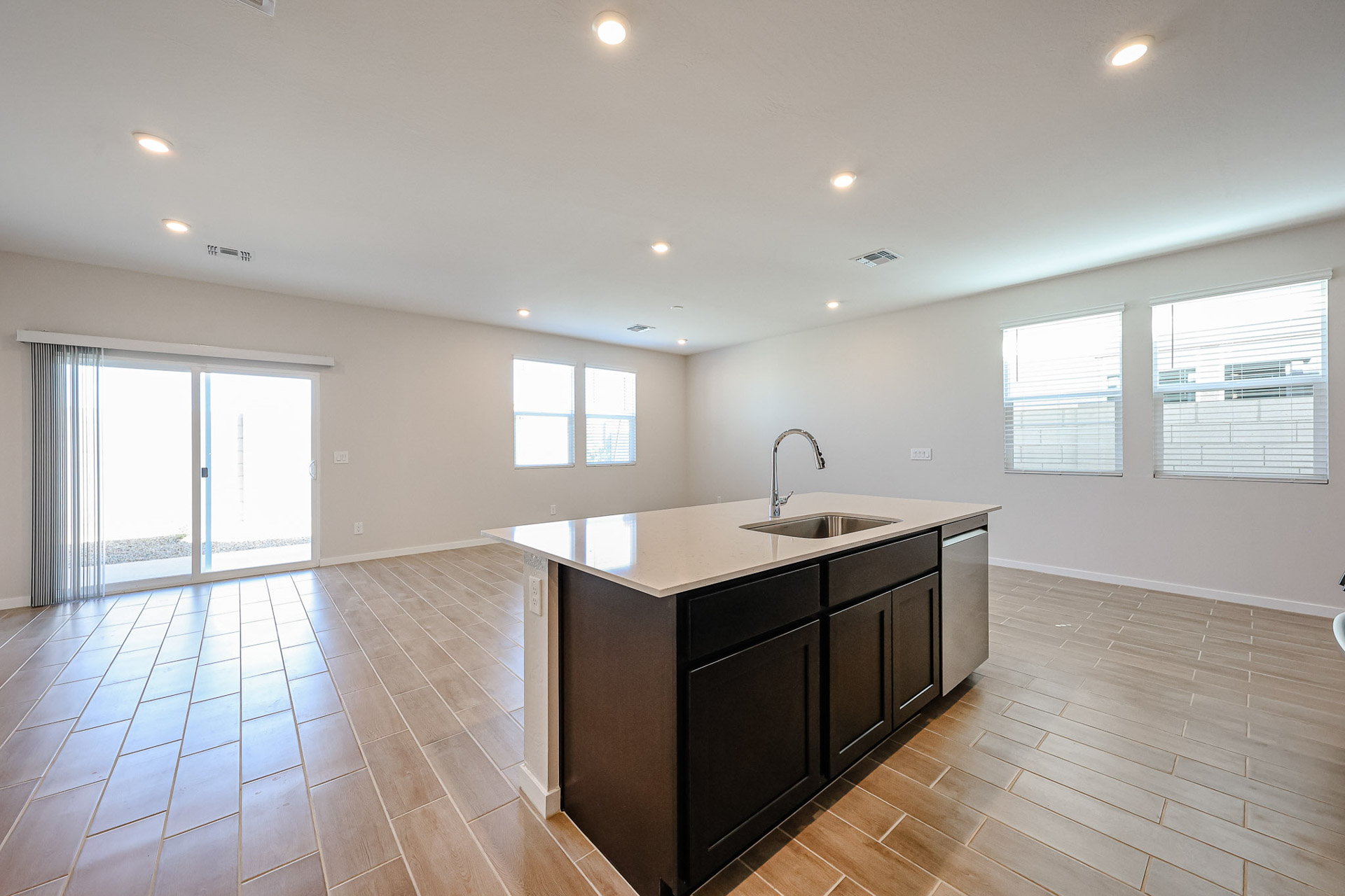 A kitchen with a wood floor.