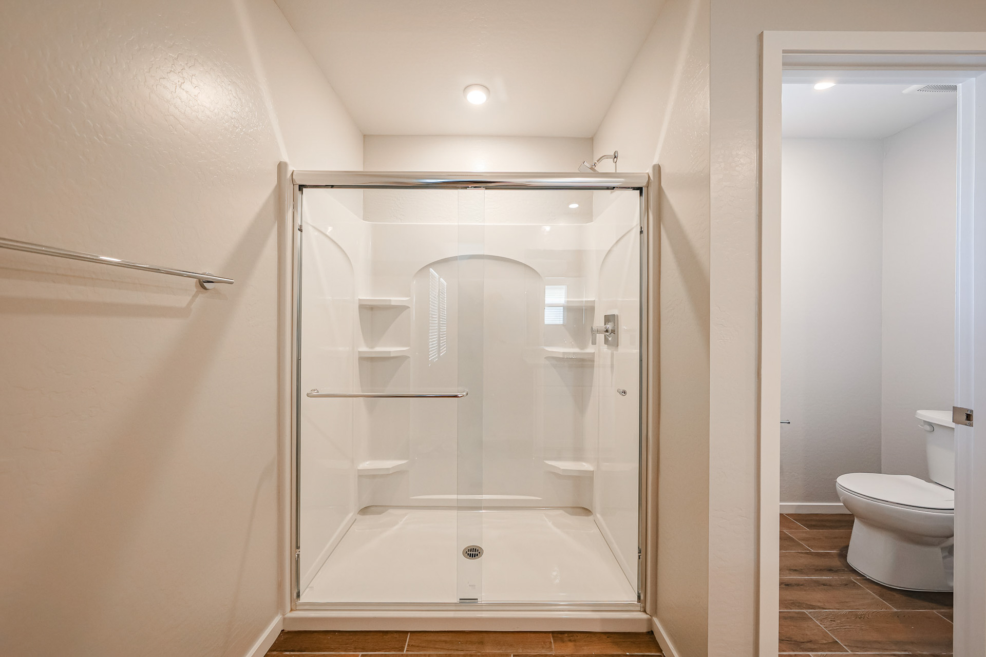 A bathroom with a glass shower.
