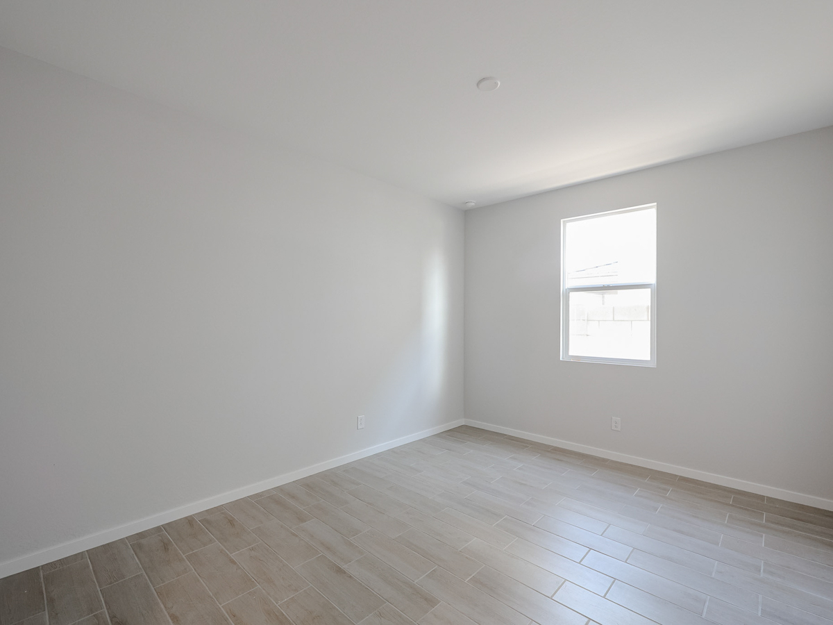 A room with a tile floor and windows.