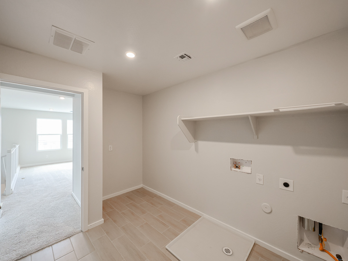 A room with a sink and a shower.