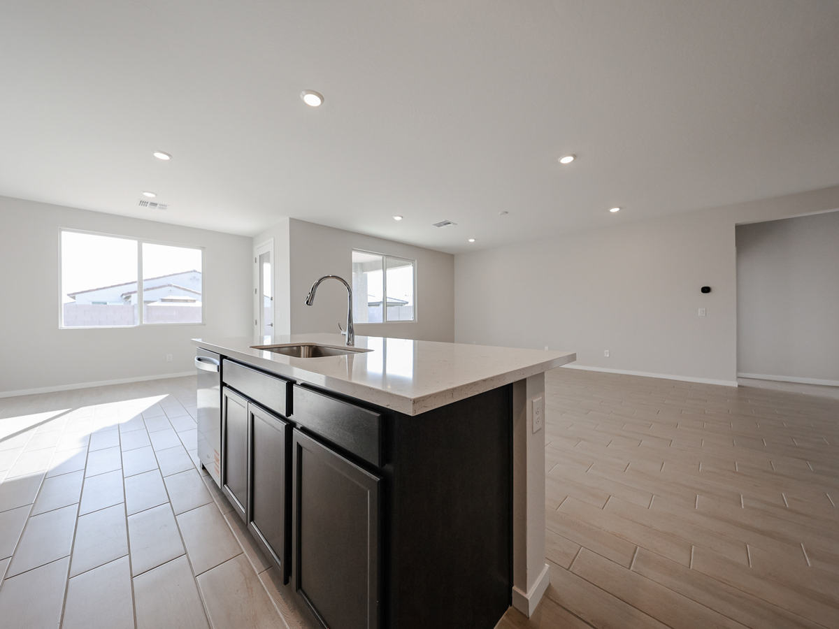A kitchen with a marble countertop.