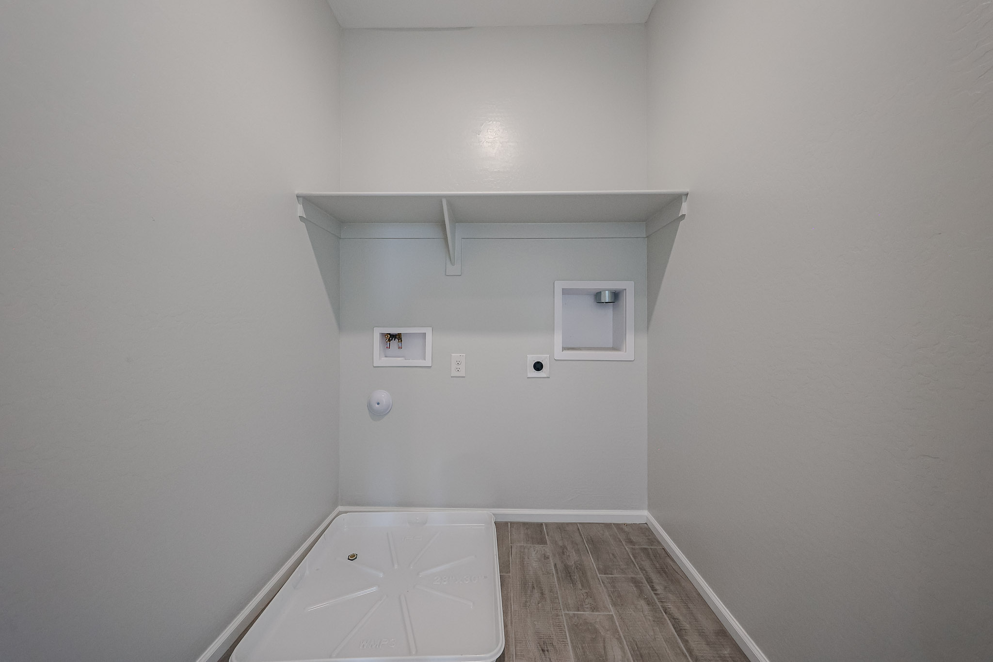 A white room with a tile floor.