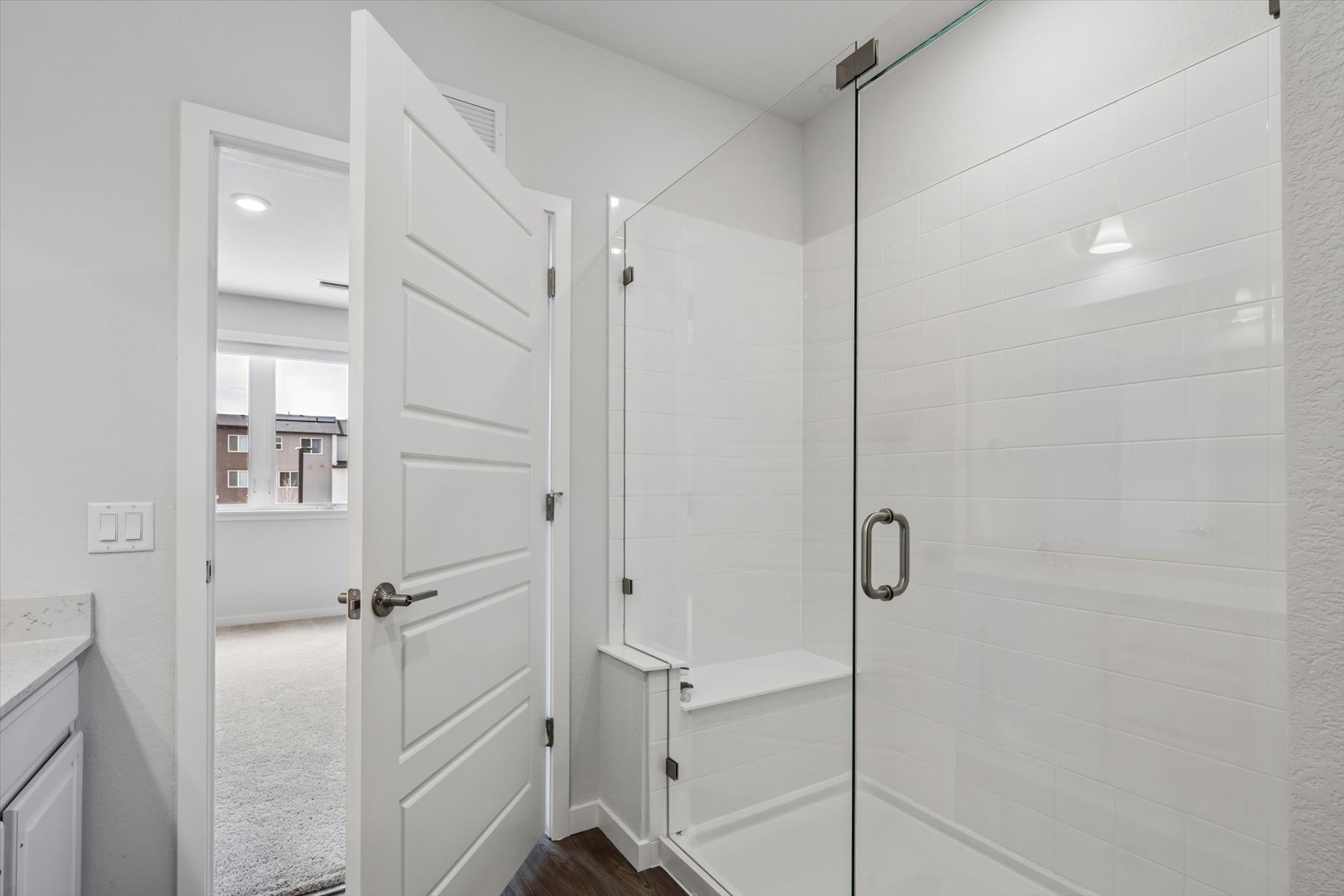 A bathroom with white doors.