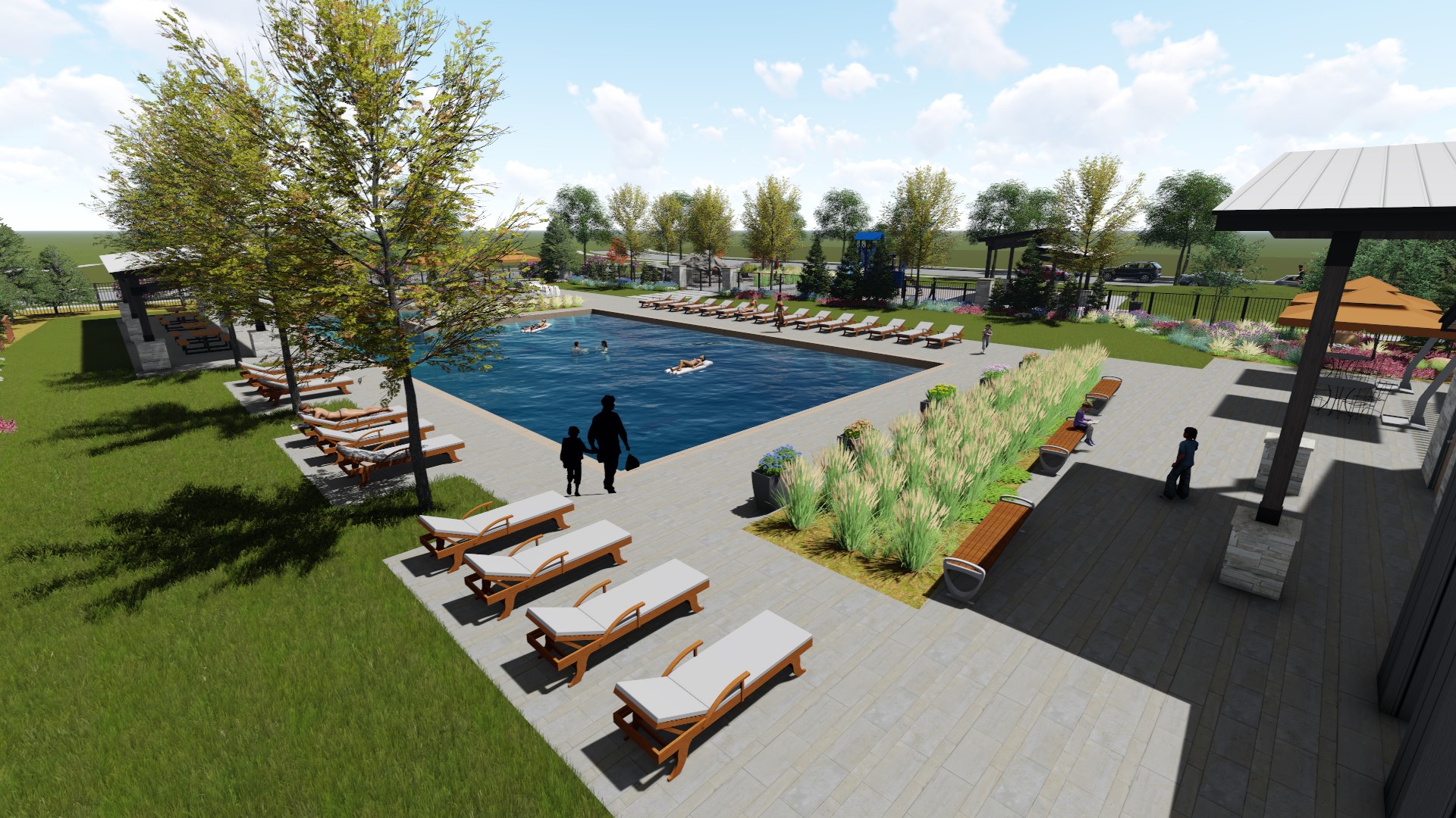 A pool with lounge chairs and a deck with a couple people walking by it.