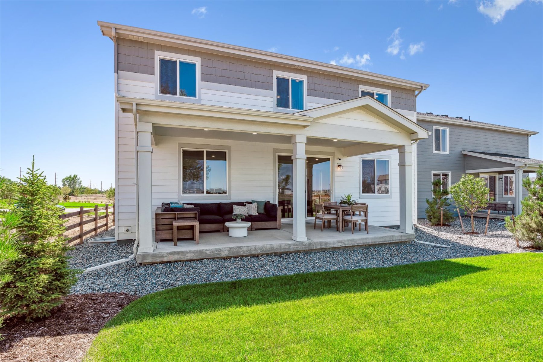 A house with a patio and a lawn.