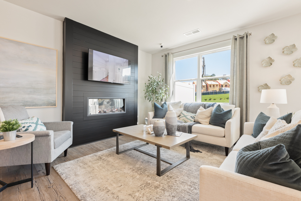A living room with a fireplace.