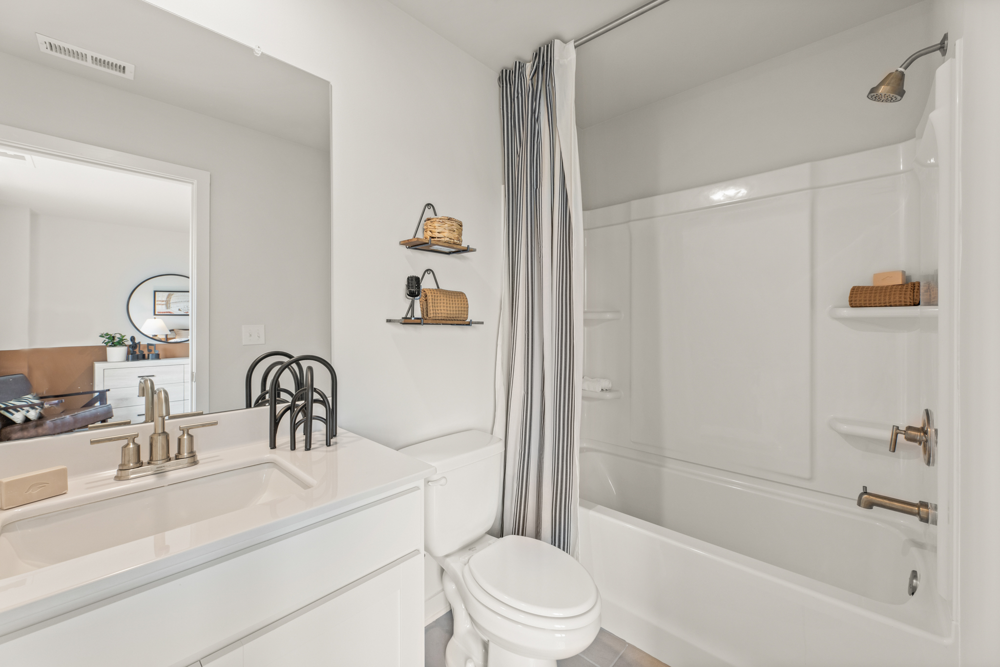 A bathroom with a tub toilet and sink.