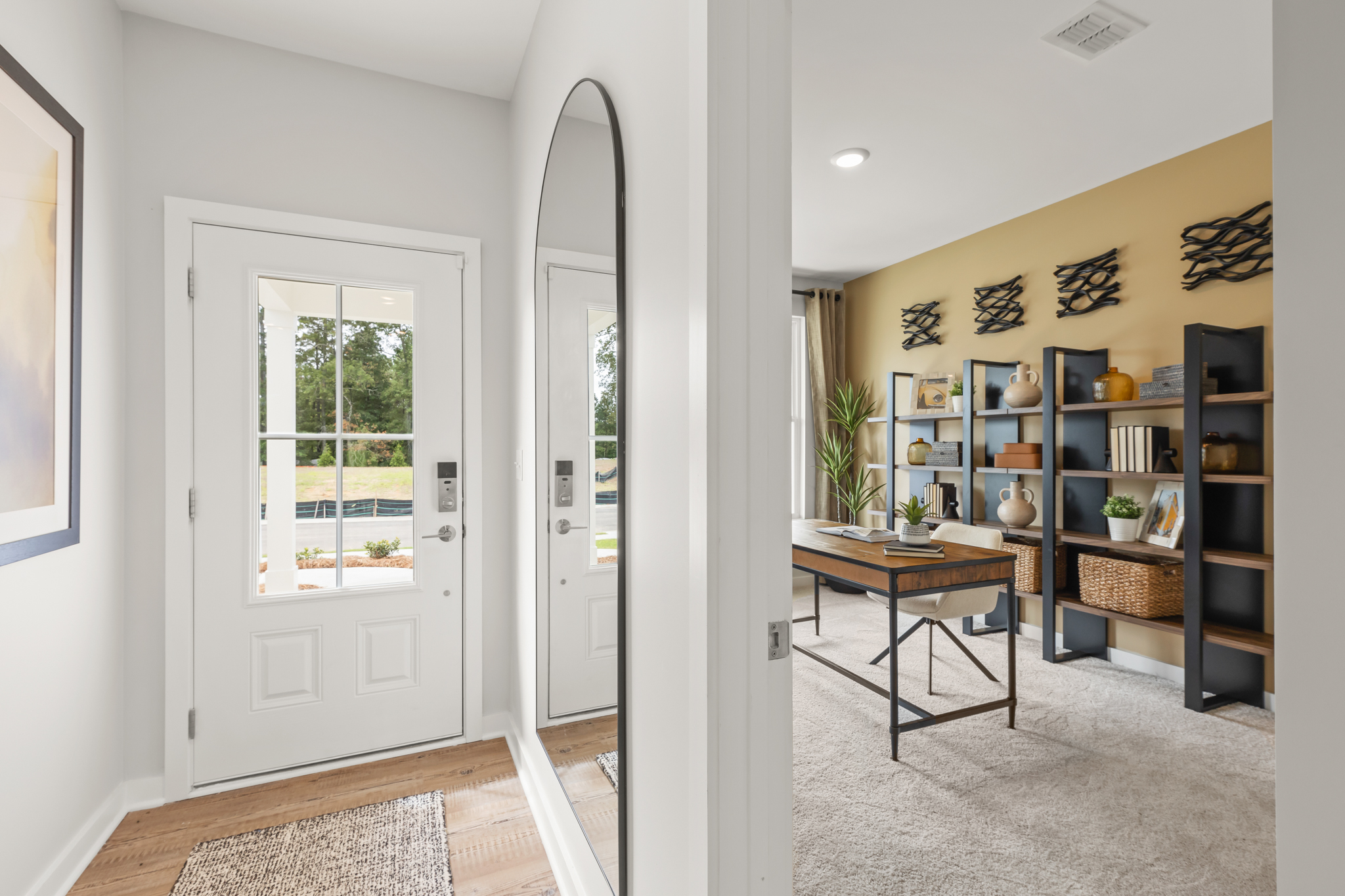 A room with a table and shelves.