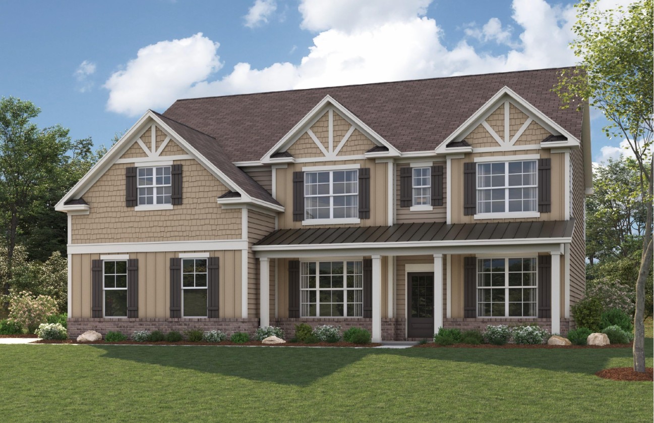 A large house with a lawn in front of it.