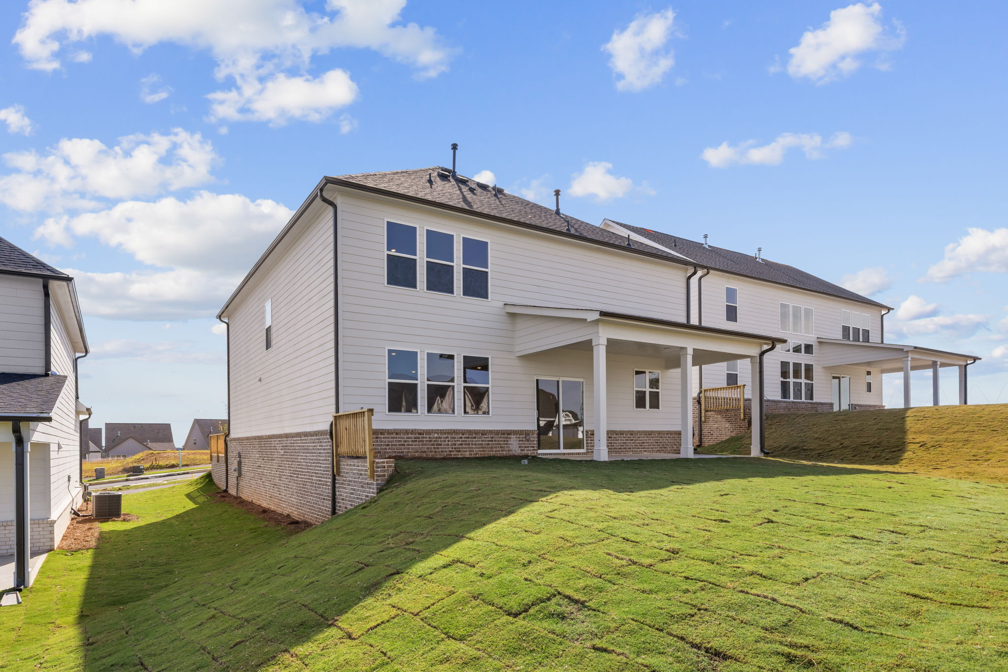 A house with a lawn in front.