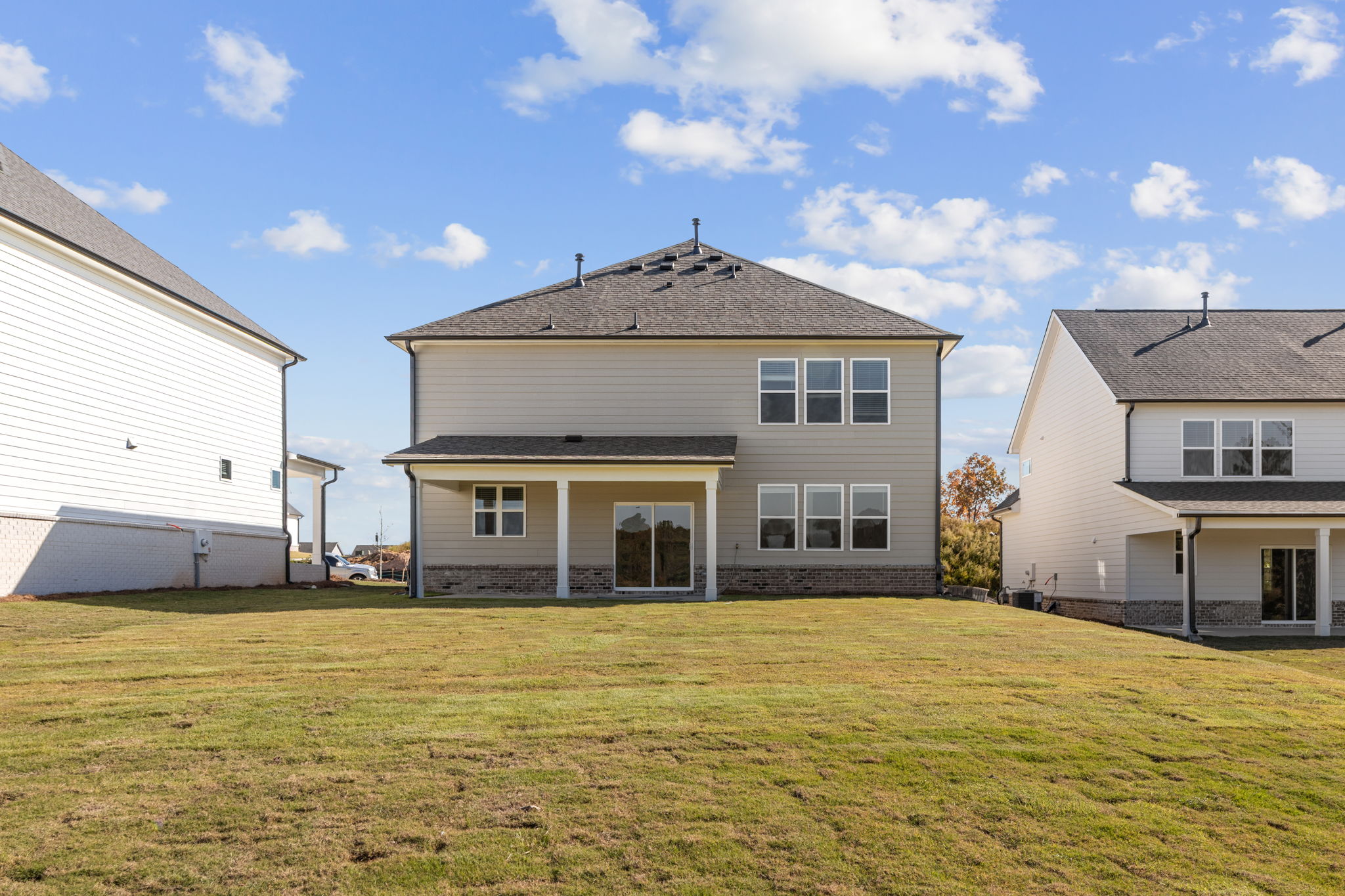 A house with a lawn in front of it.