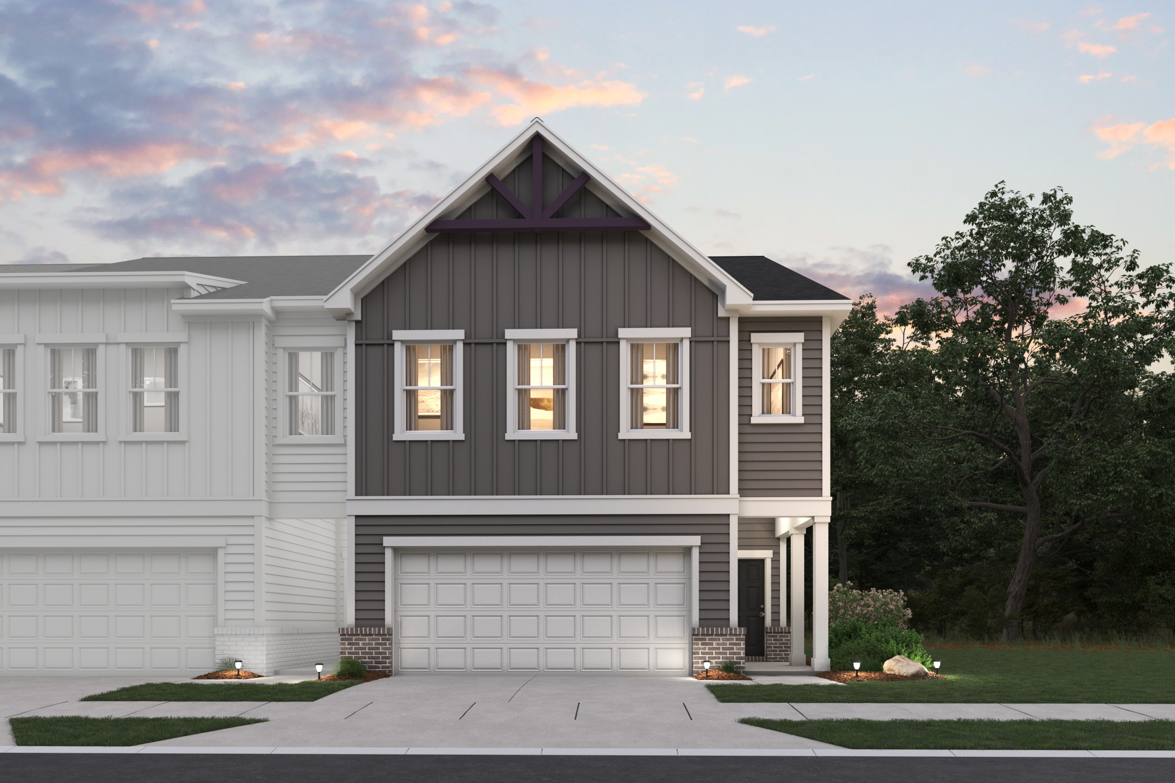 A grey house with a garage.