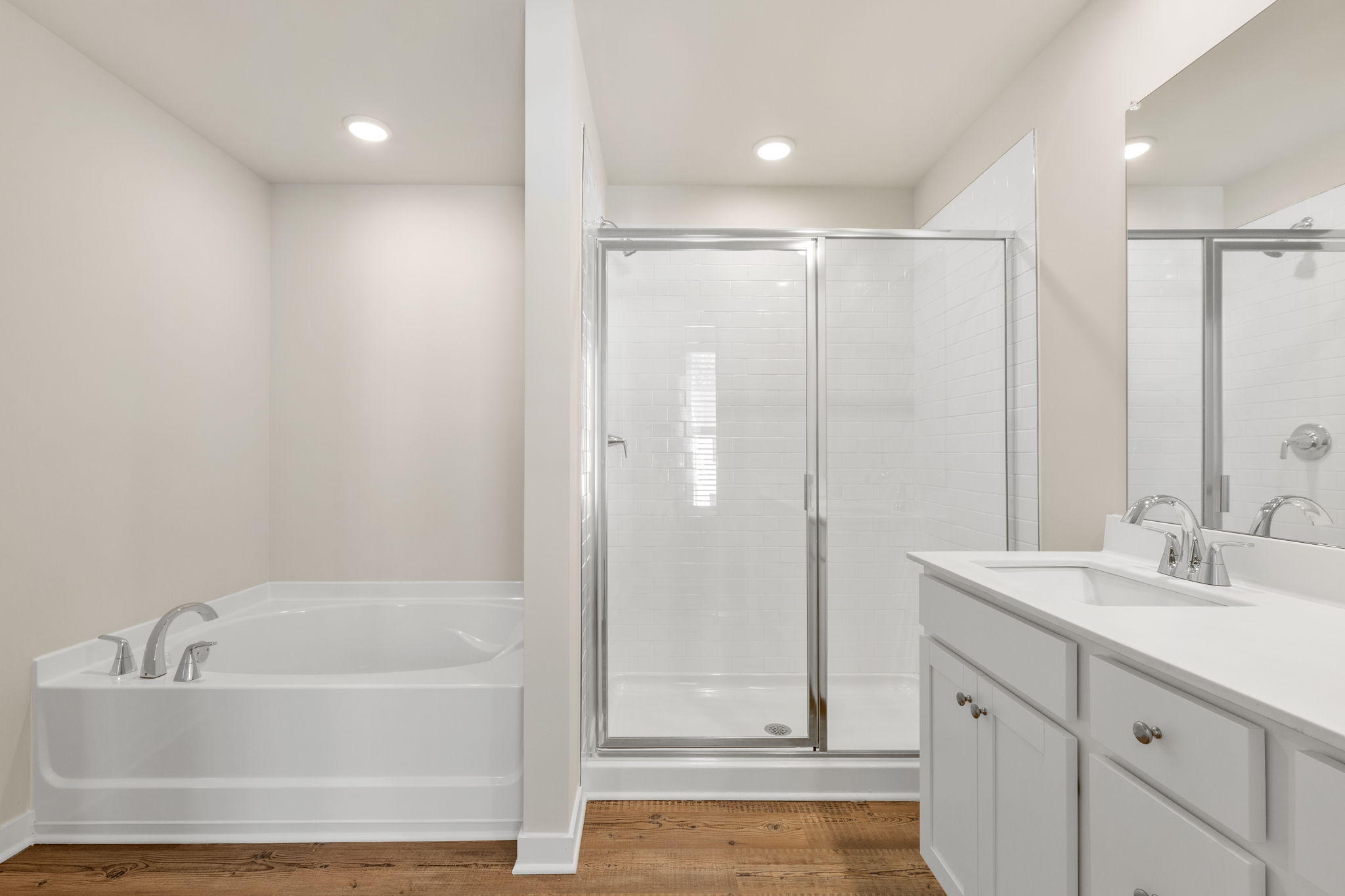 A bathroom with a glass shower.