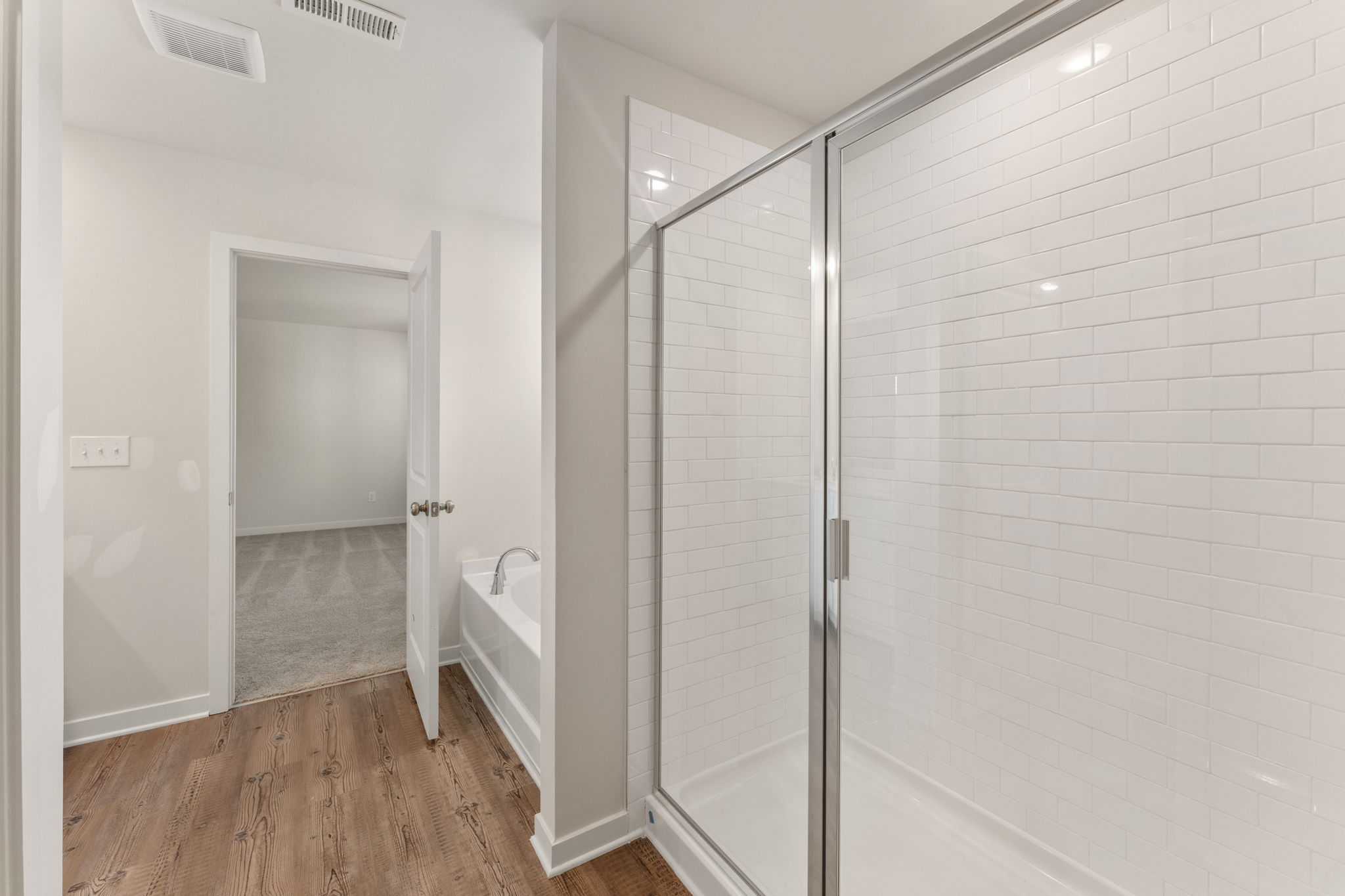 A bathroom with a glass shower.