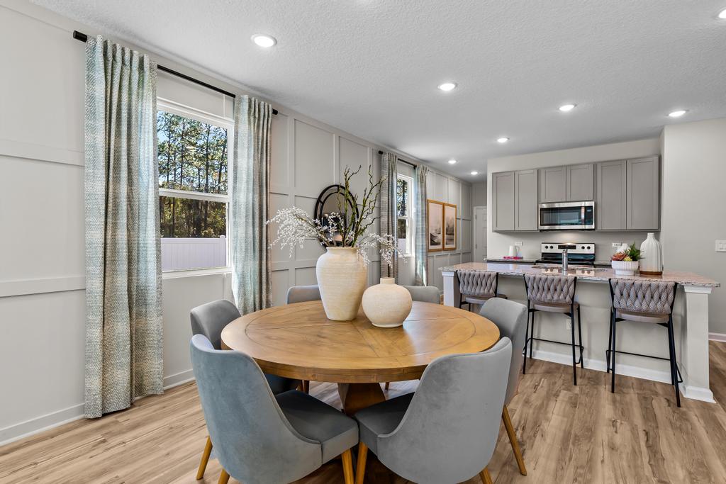 A kitchen with a dining table.