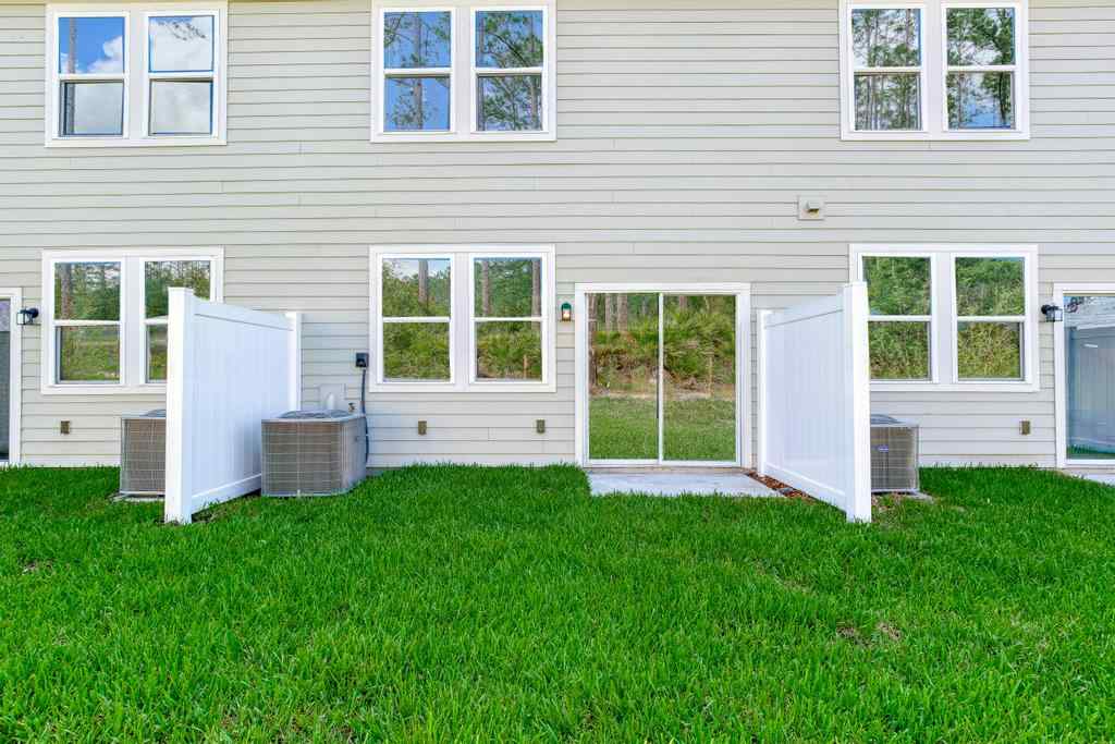 A house with a lawn in front of it.