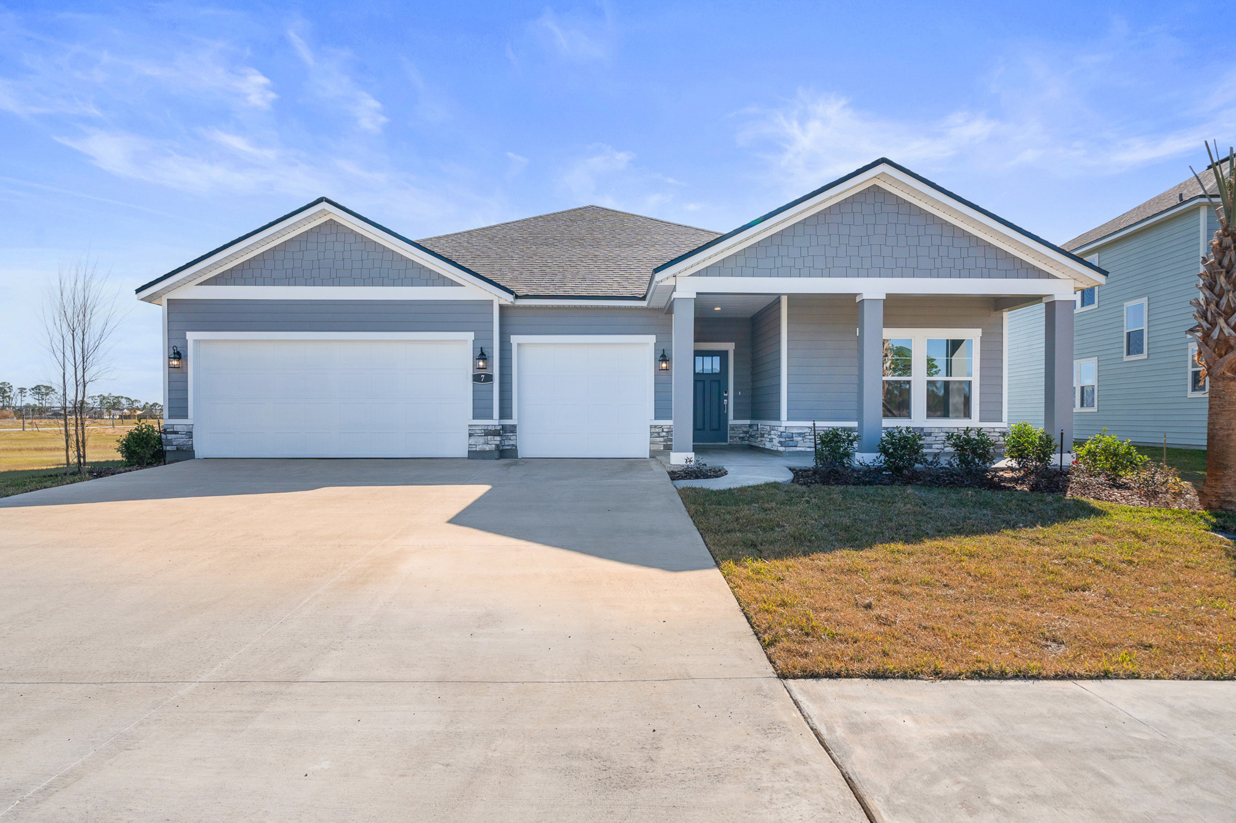 Lot 46 Front Exterior with 3 Bay Garage and Brick at Reserve East
