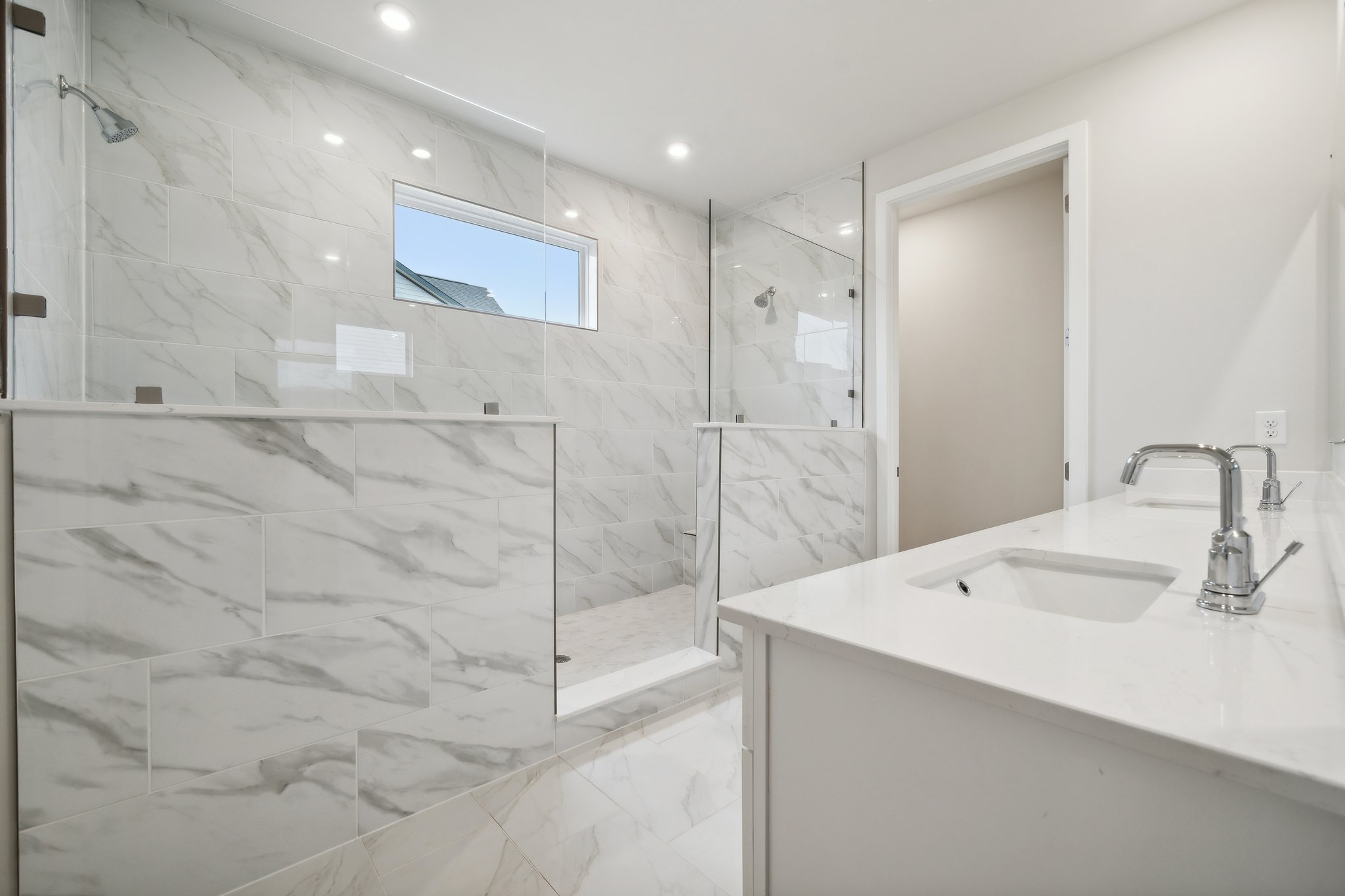 A bathroom with a glass shower.