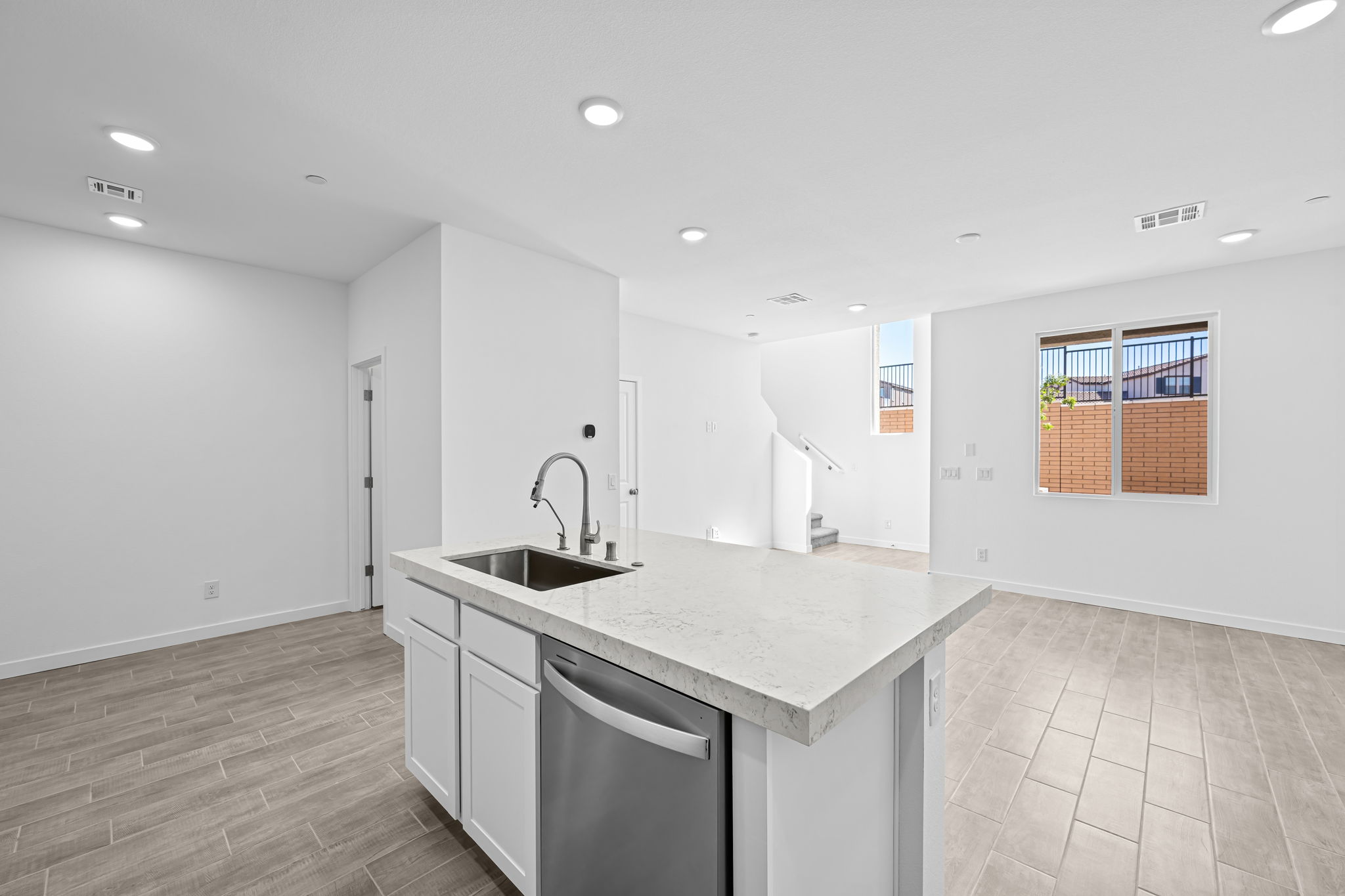 A kitchen with a sink and a counter top.