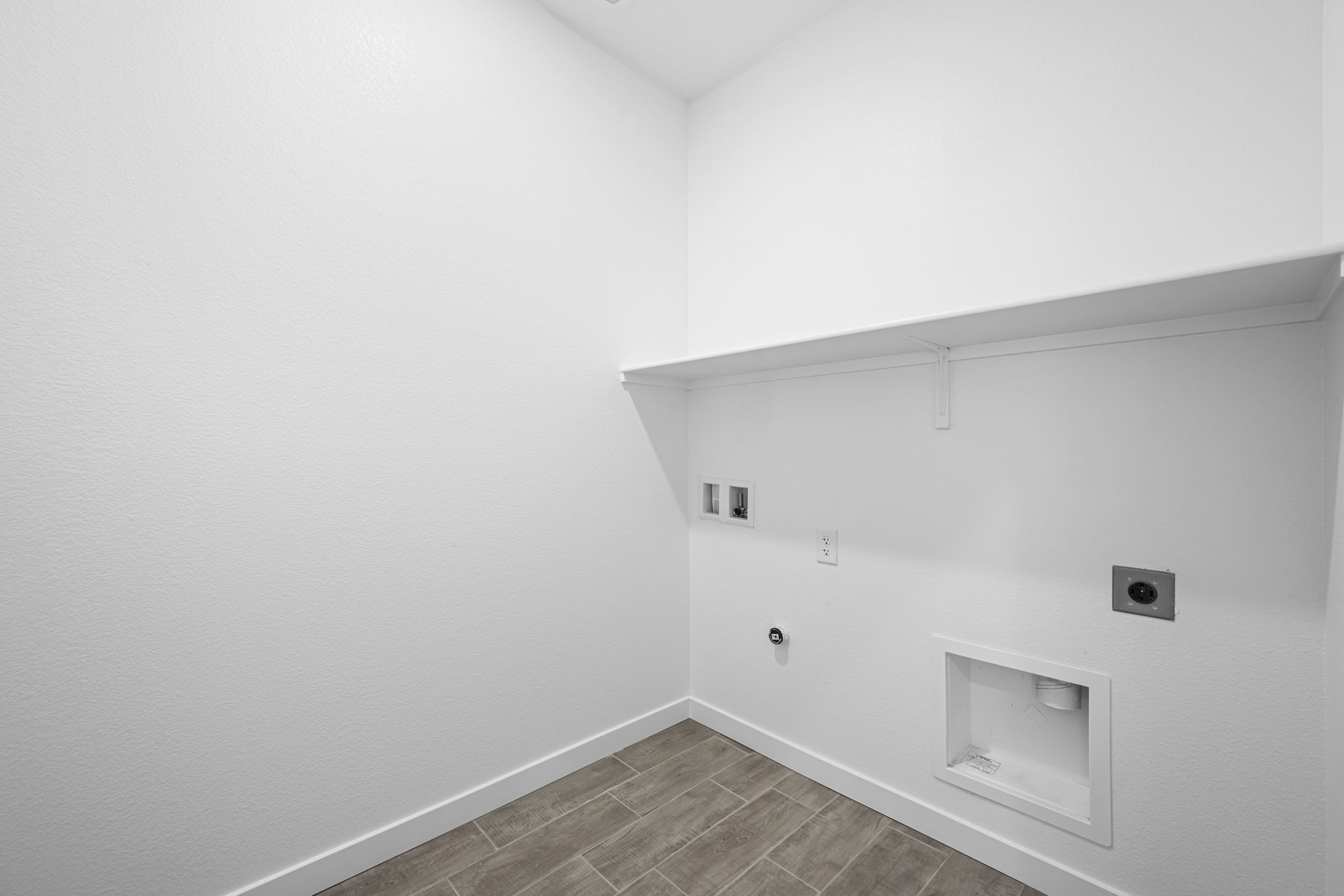 A white wall with a vent.