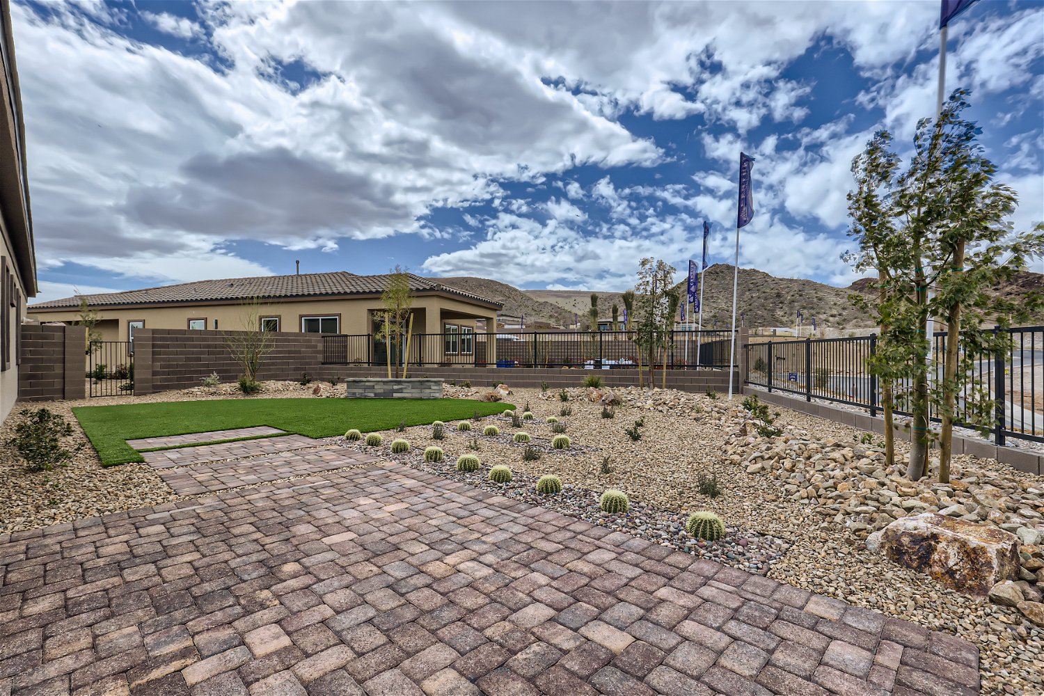 A brick driveway leading to a building.