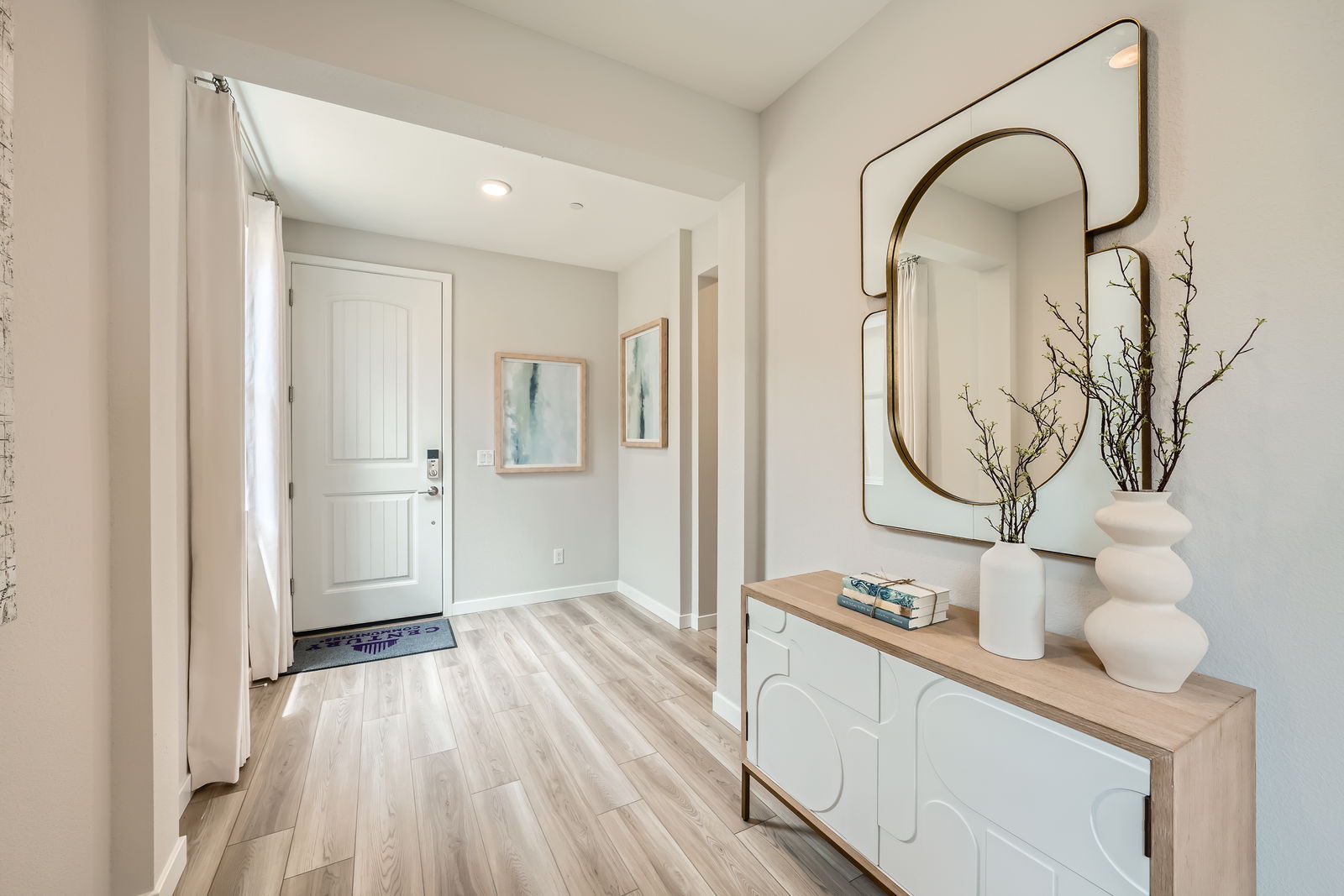 A room with a mirror and a table.