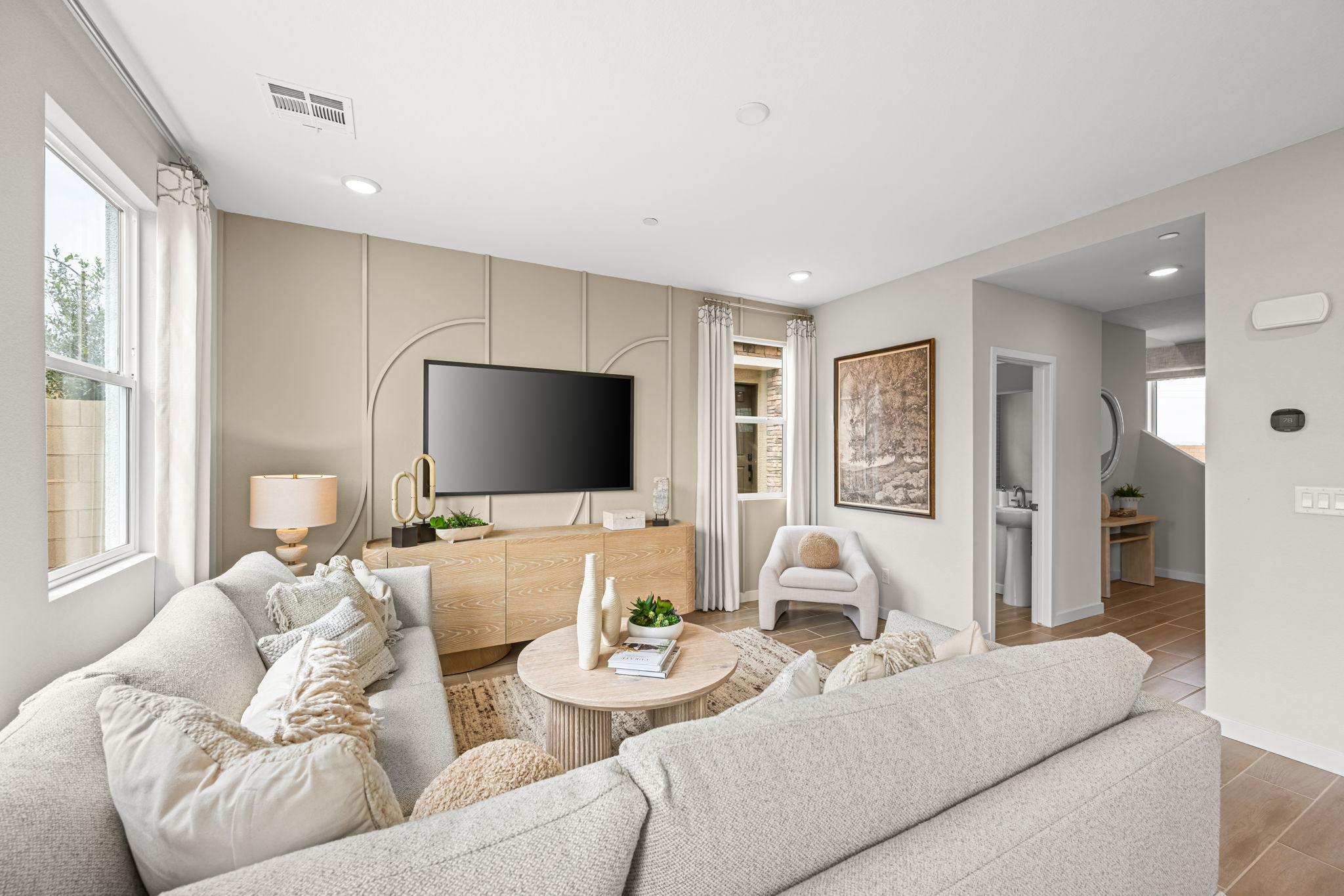 A living room with a tv and couches.