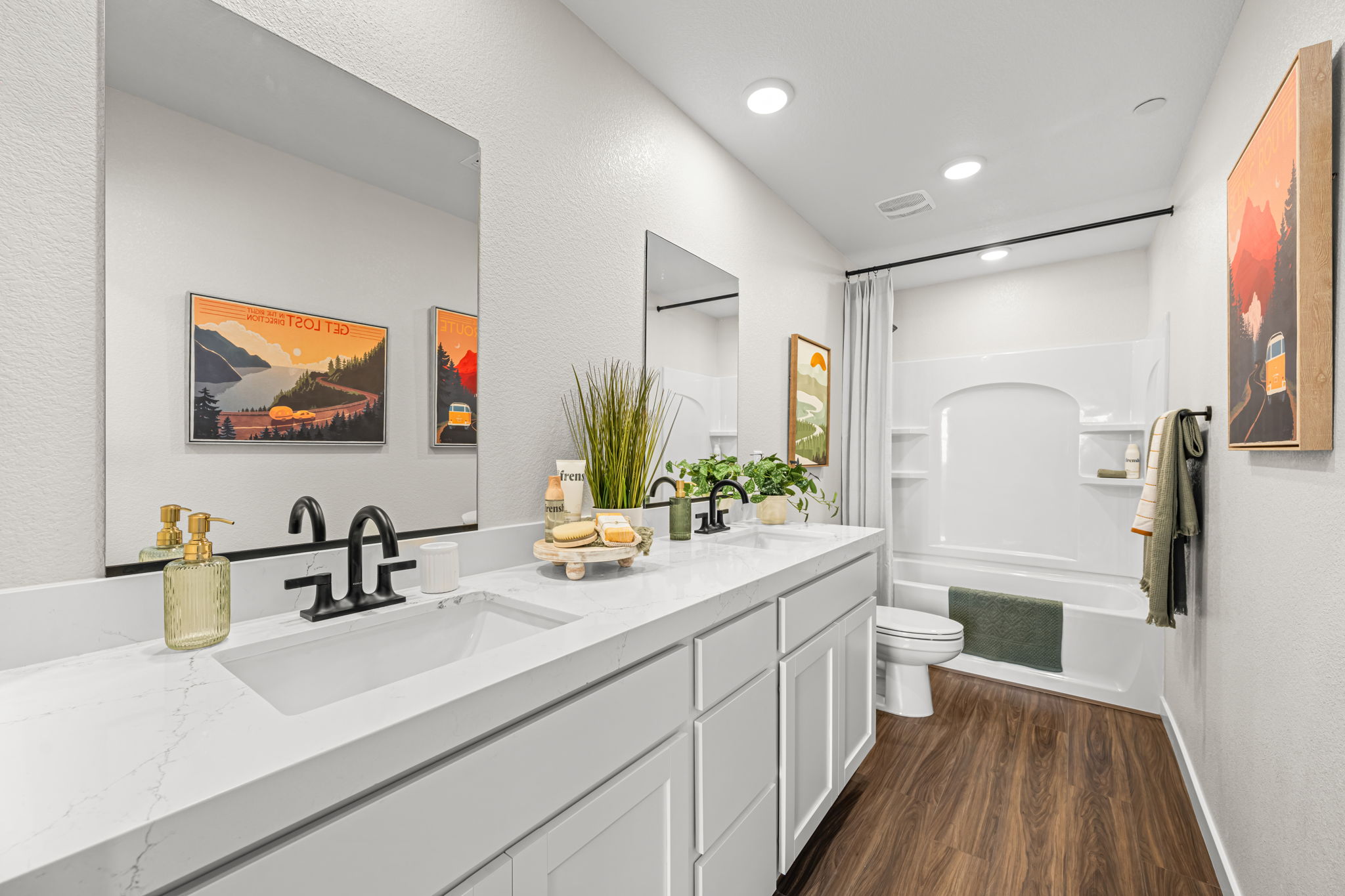 A bathroom with a sink and a toilet.