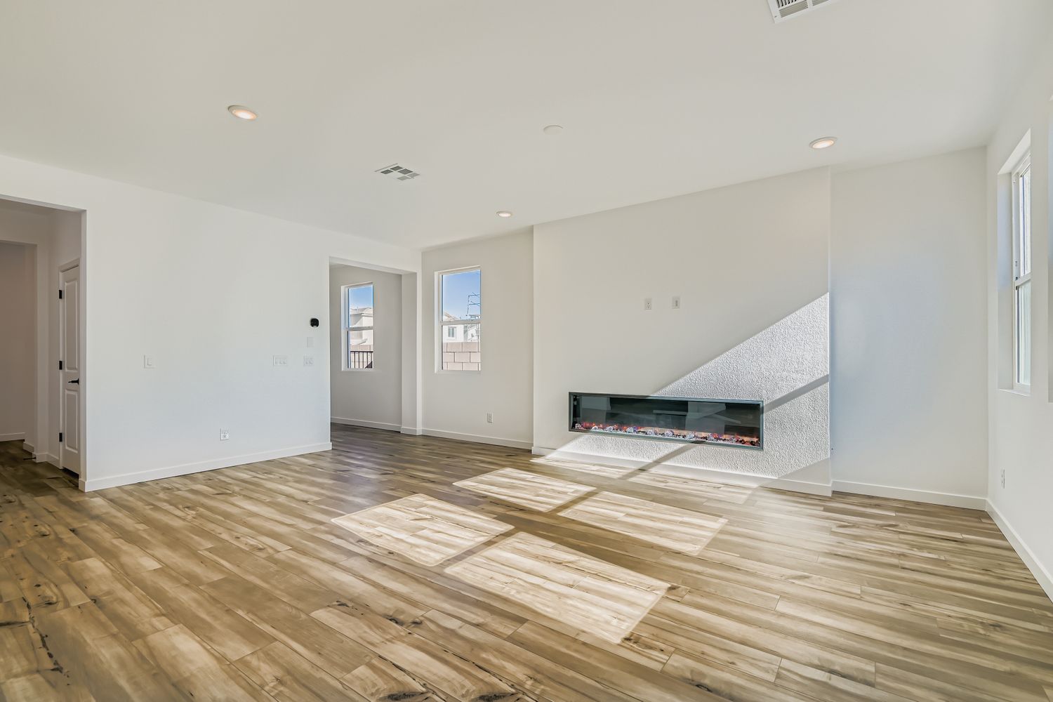 A room with a wood floor and a wood floor.