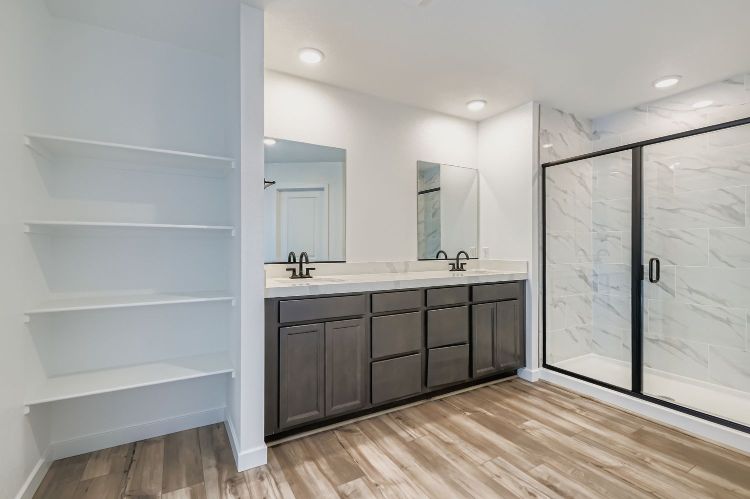 A bathroom with a glass shower.