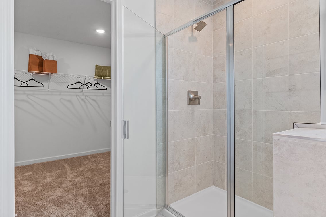 A bathroom with a glass shower.