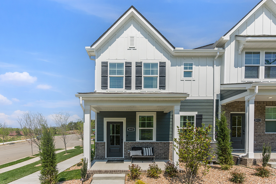 A white house with a driveway.