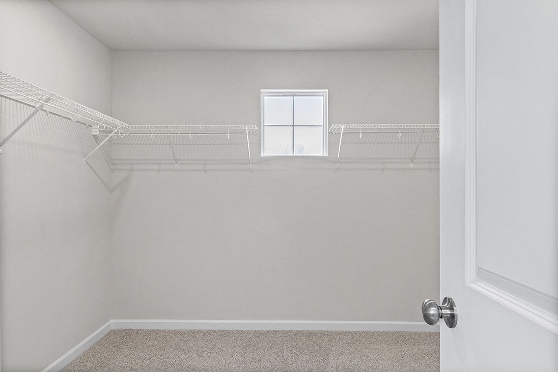 A white room with a white door.