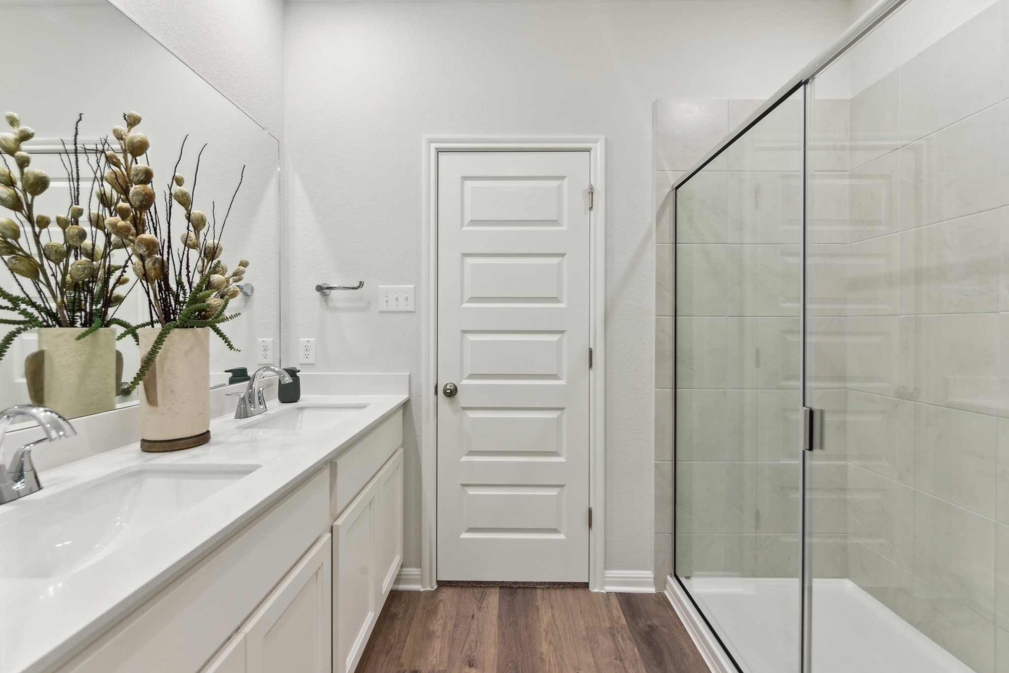 A bathroom with a glass shower.
