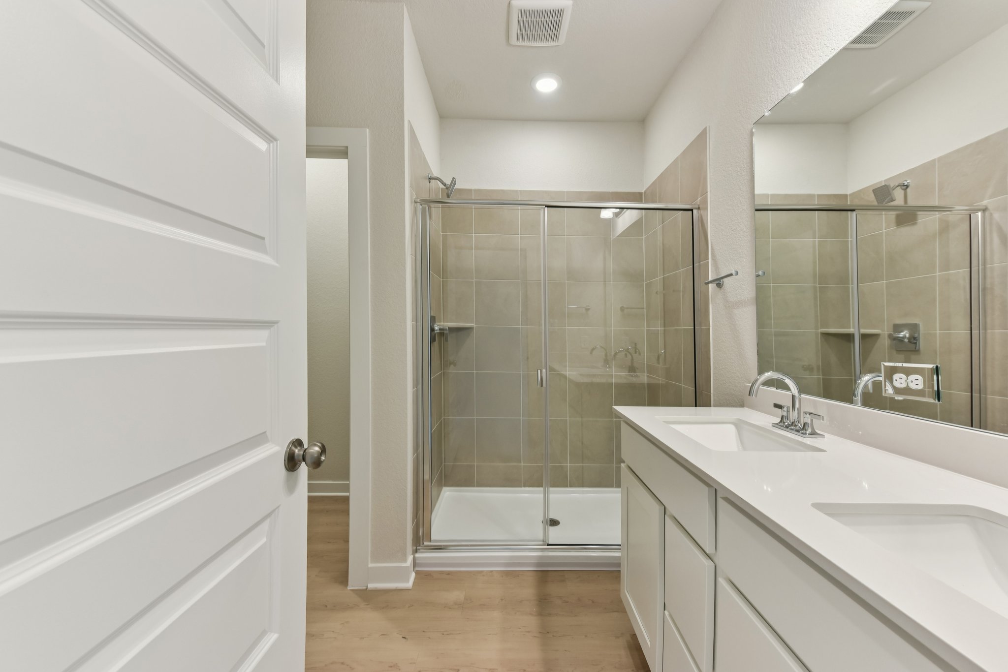 A bathroom with a glass shower.