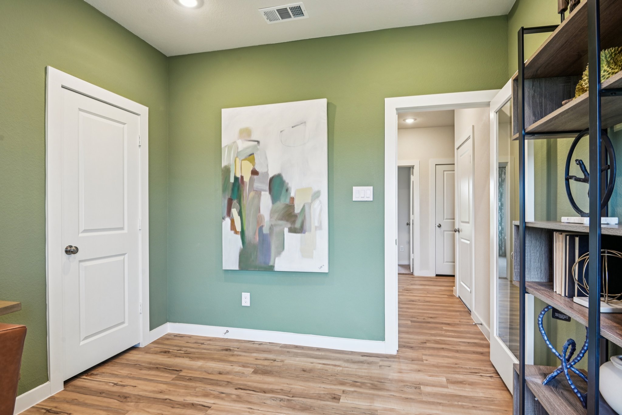 A room with a green wall.