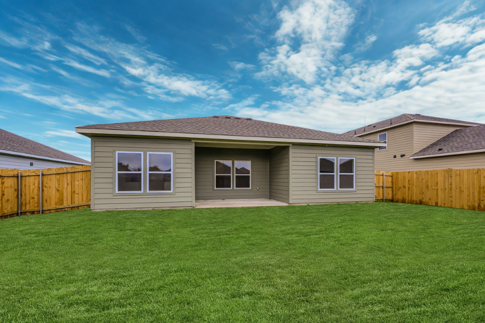 A house with a green lawn.