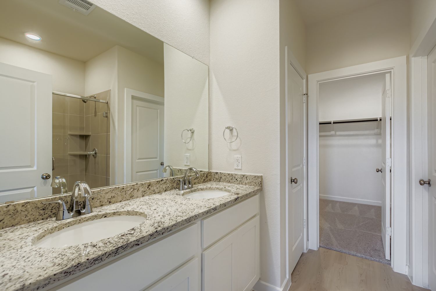 A bathroom with a marble countertop.