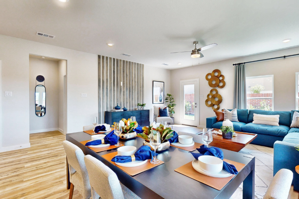 A living room with a large table.