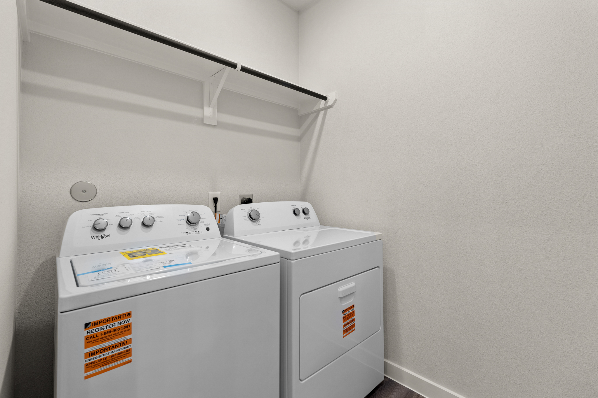 A washing machine in a room.