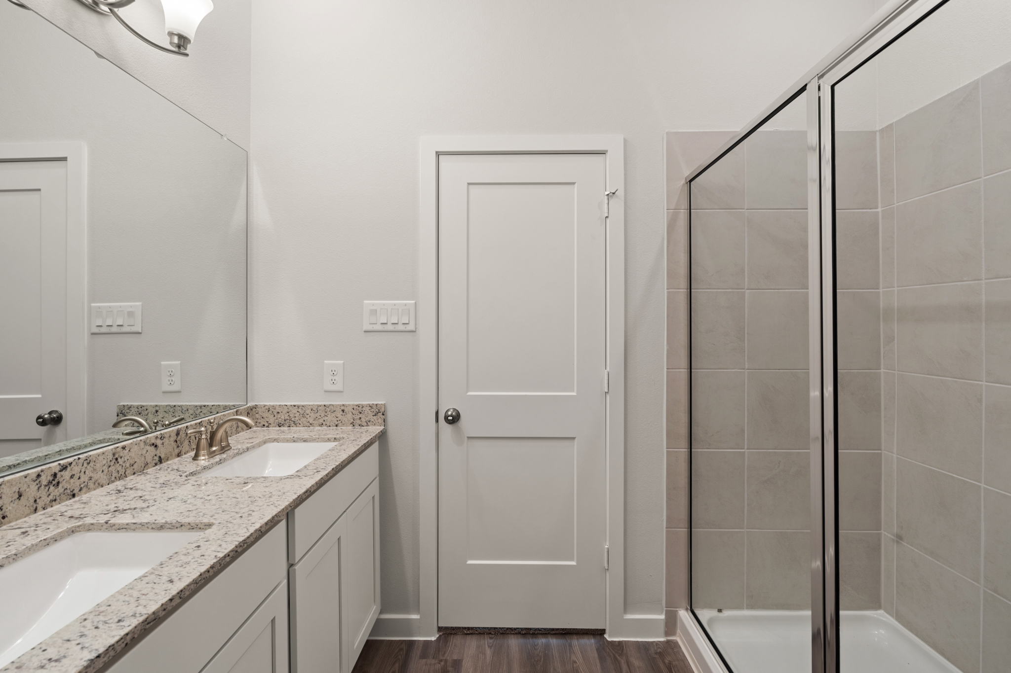 A bathroom with a glass shower.