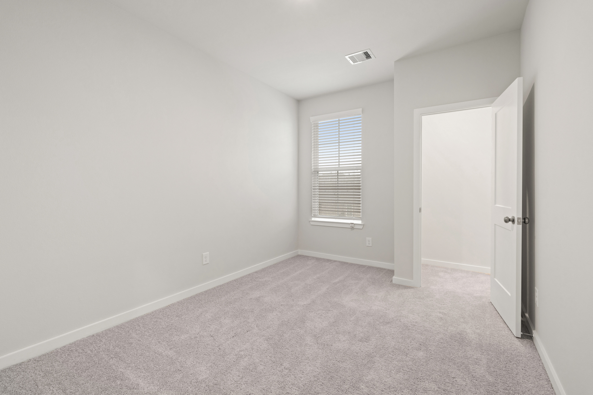 A room with a door and a window.