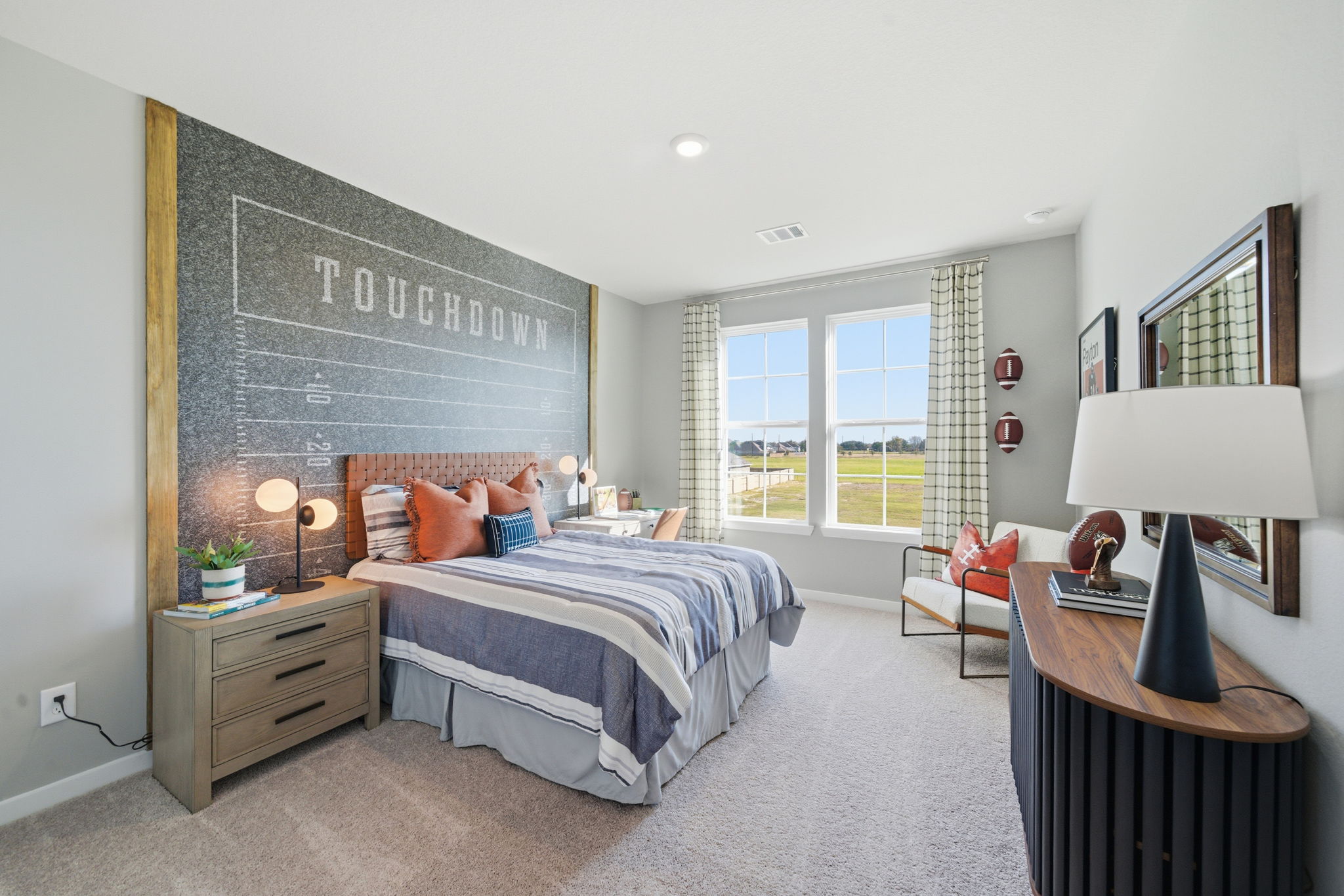 A bedroom with a large window.