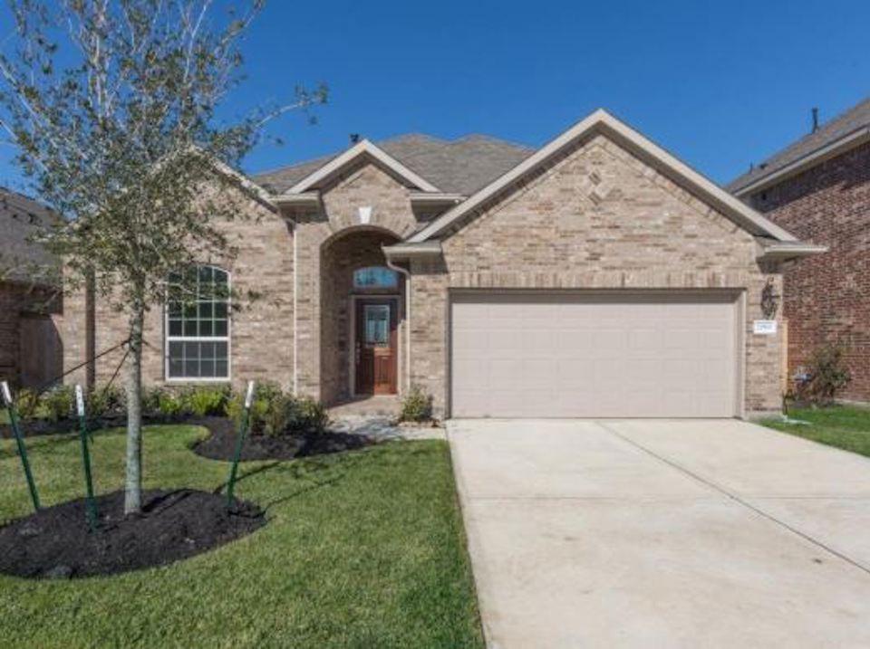 A brick building with a garage.